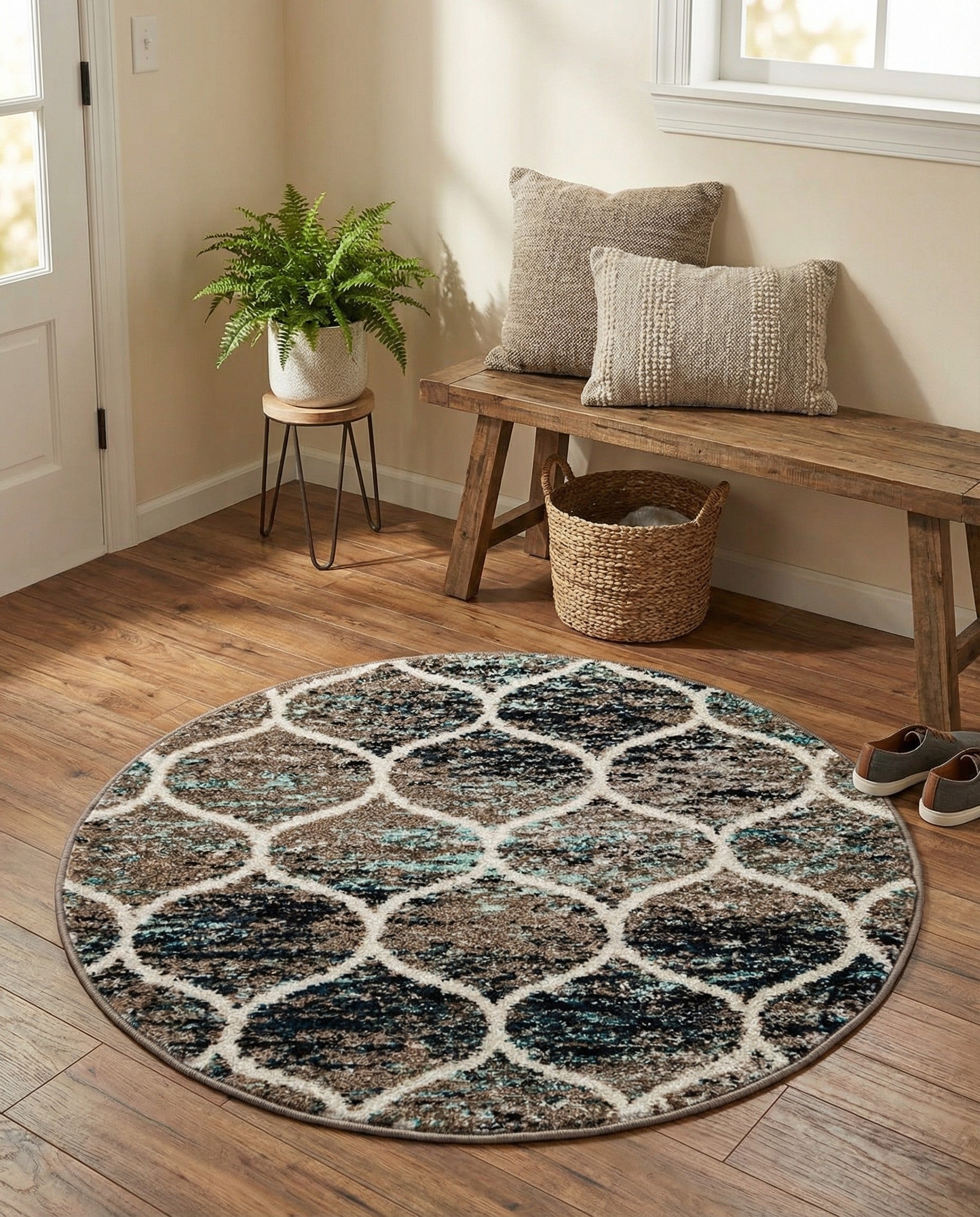 A 3' 0 x 3' 0 round blue and multi-colored modern trellis rug with a thin pile.