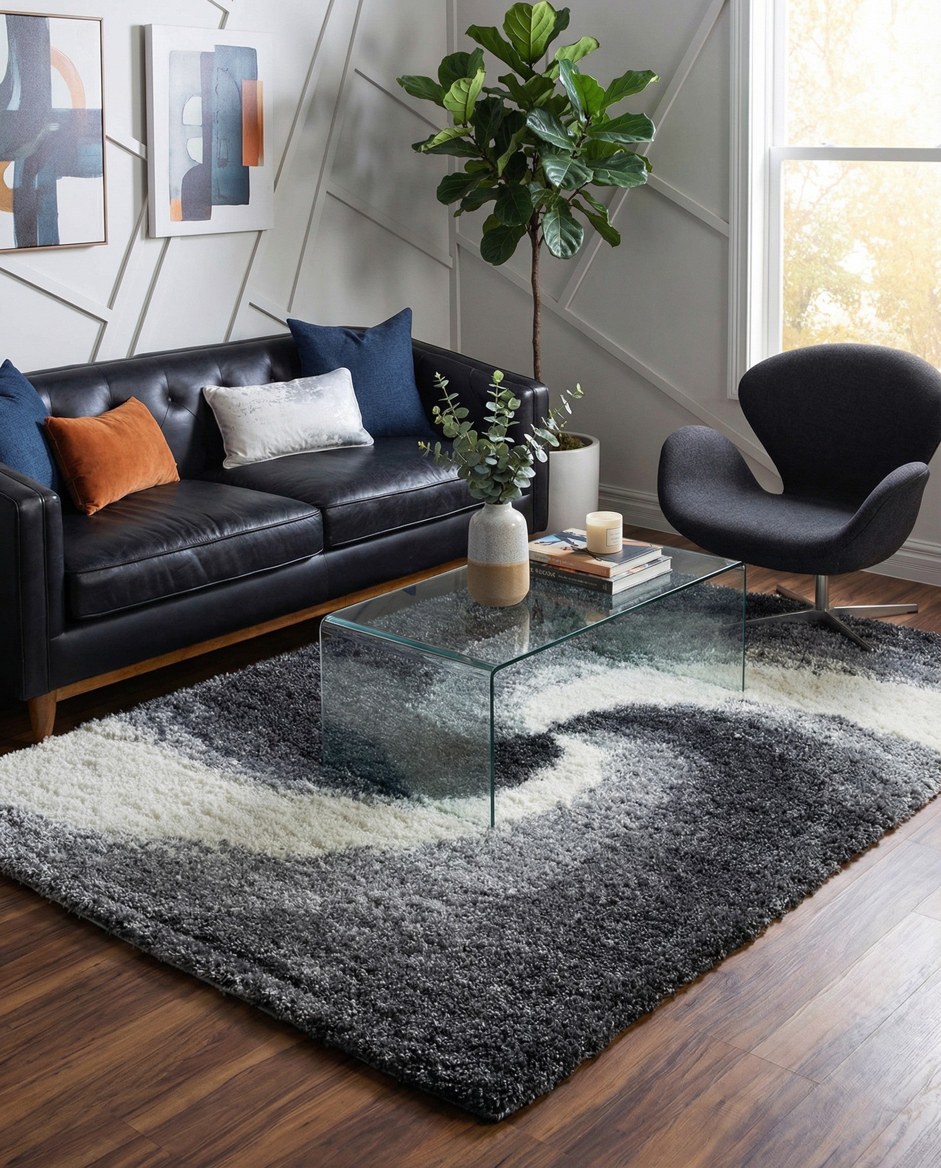 A rectangular 8x10 gray shag rug featuring a swirling abstract pattern in various shades of gray and white.