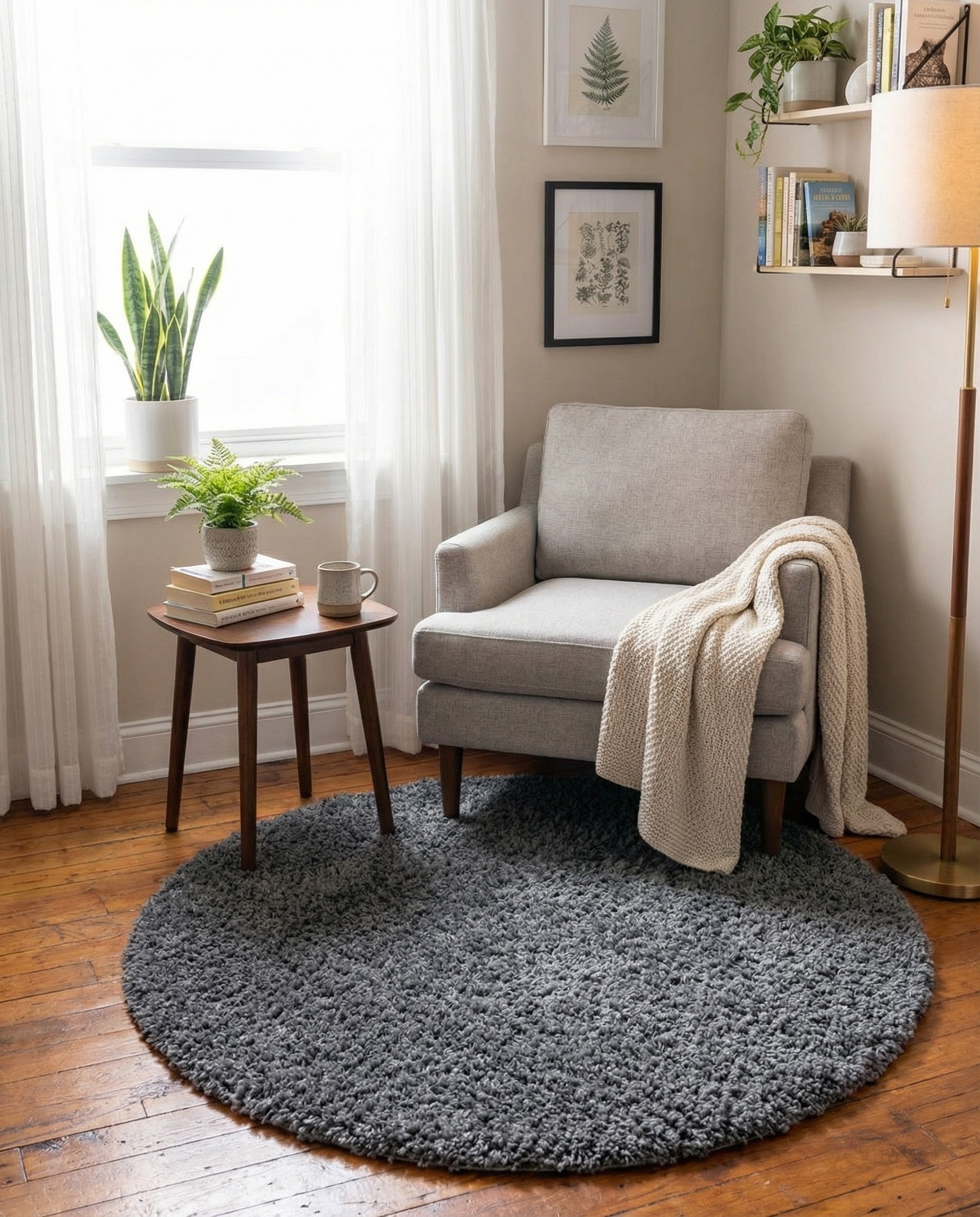 A soft, plush 3' 0 round gray shag rug with a textured pile, perfect for adding comfort to any indoor space.