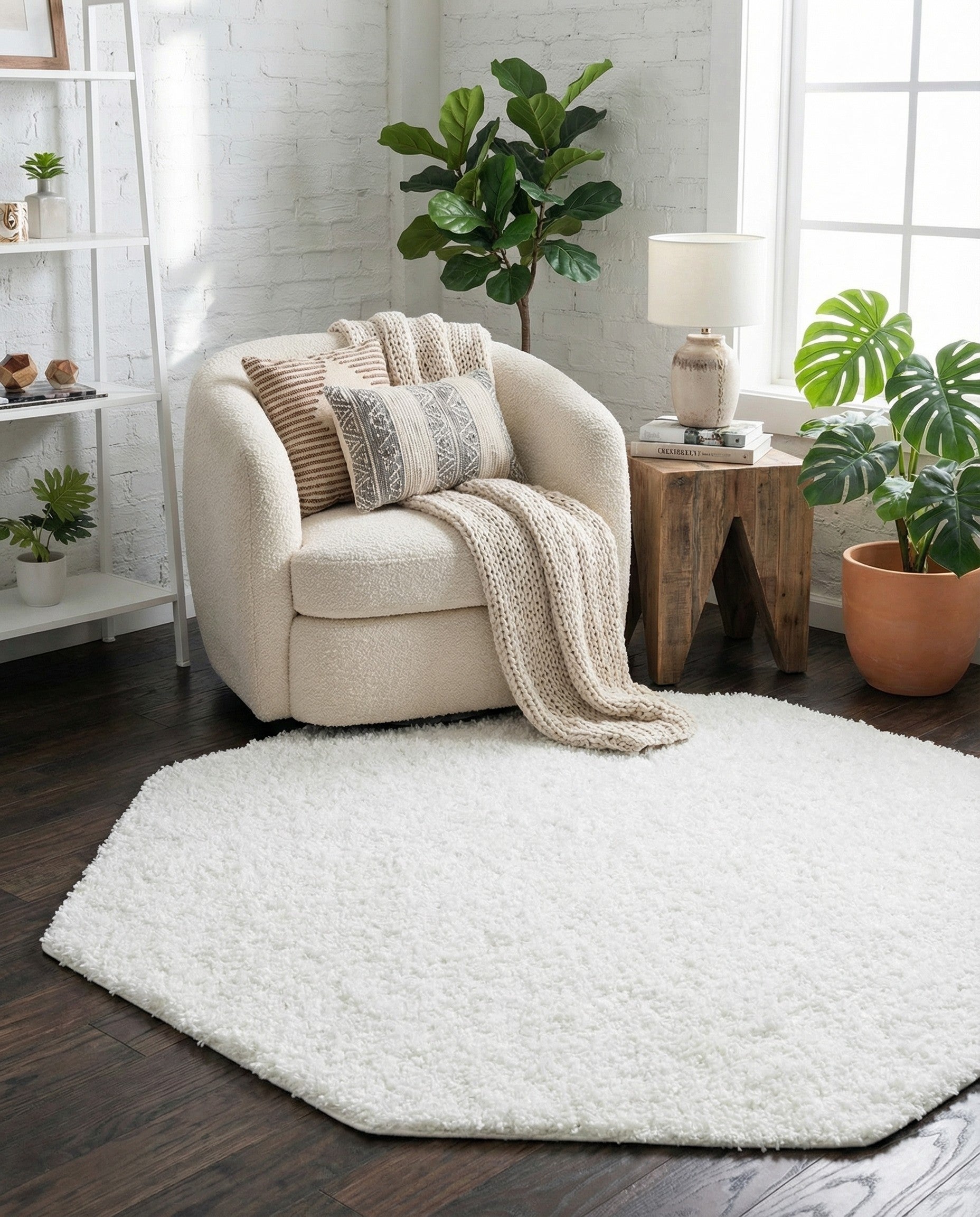 A soft, white 4' 0 x 4' 0 octagon shag rug with a textured pile, perfect for a modern indoor space.