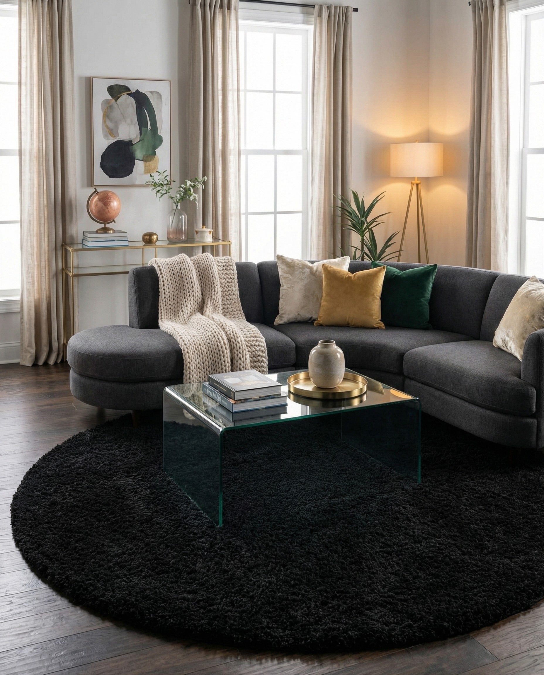 A plush, round black shag rug, 7' 10 x 7' 10, offering a soft, solid modern accent for any indoor space.