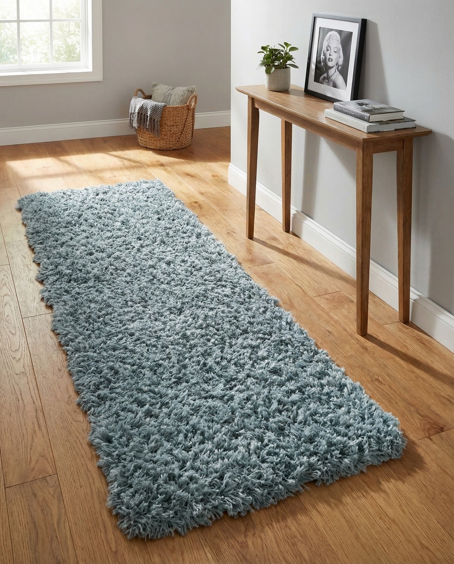A soft, plush 6 ft runner rug in varying shades of blue, perfect for a hallway.