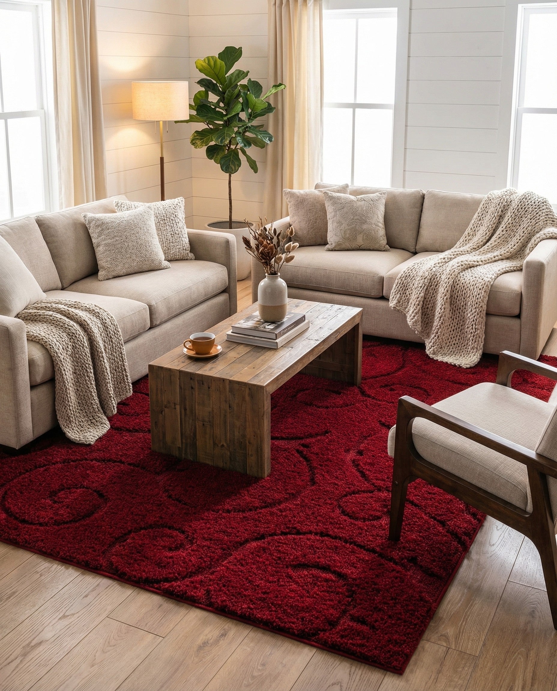 A rectangular 7x10 red shag rug with a subtle, textured floral pattern, suitable for a living room or bedroom.
