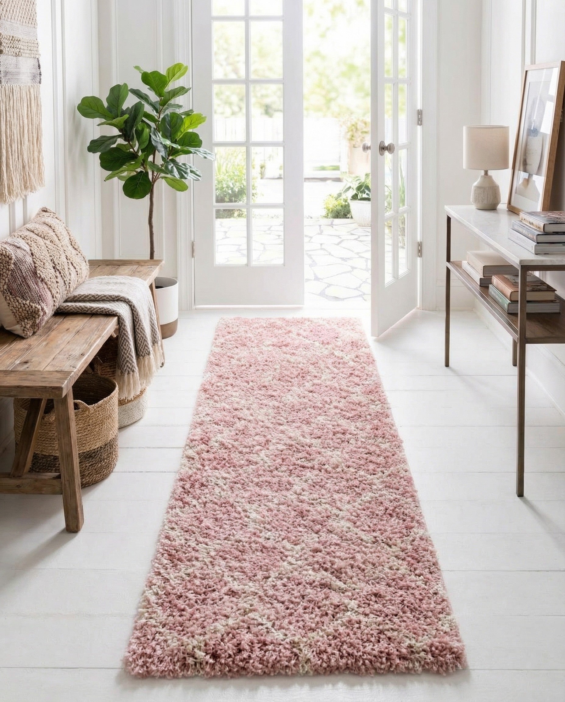A 6 ft pink runner rug with a modern trellis pattern and high/low textured pile, ideal for hallways.