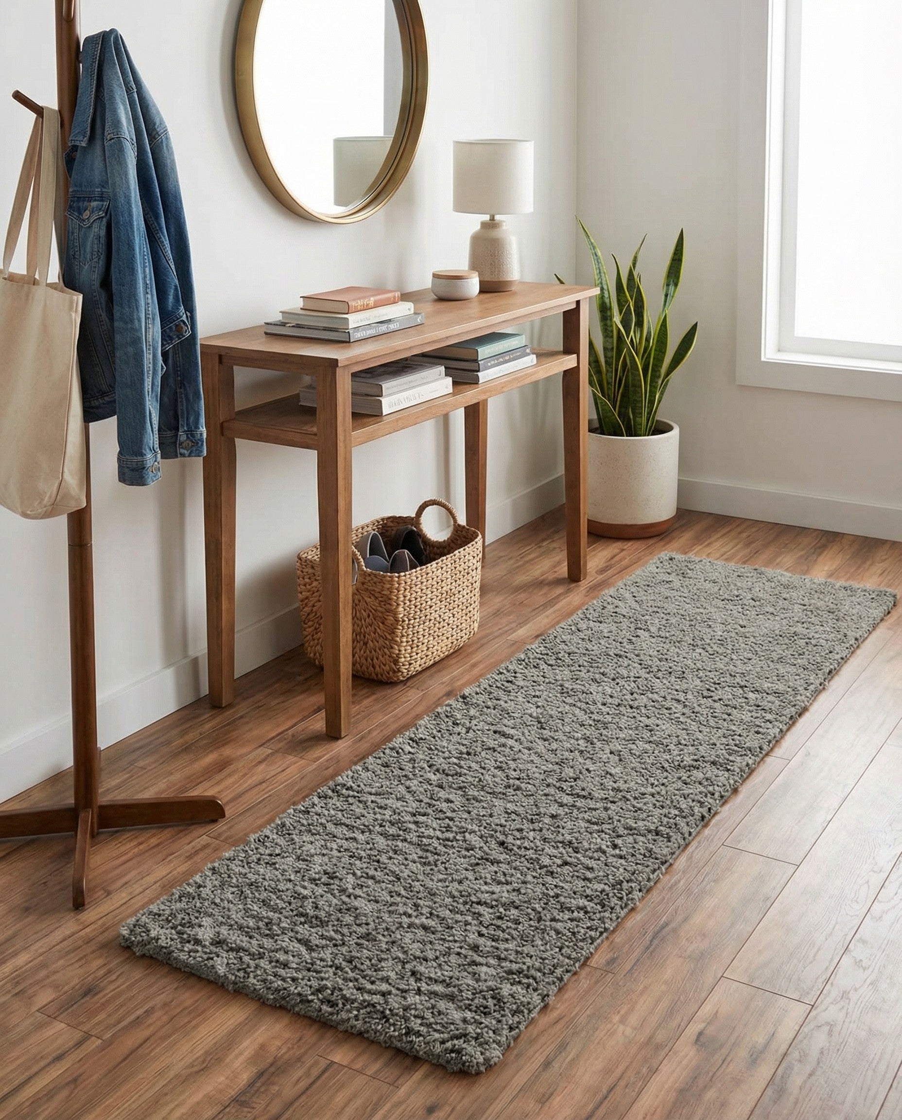 A 6 ft runner rug from the Solid Shag collection in a textured gray color, perfect for a hallway.