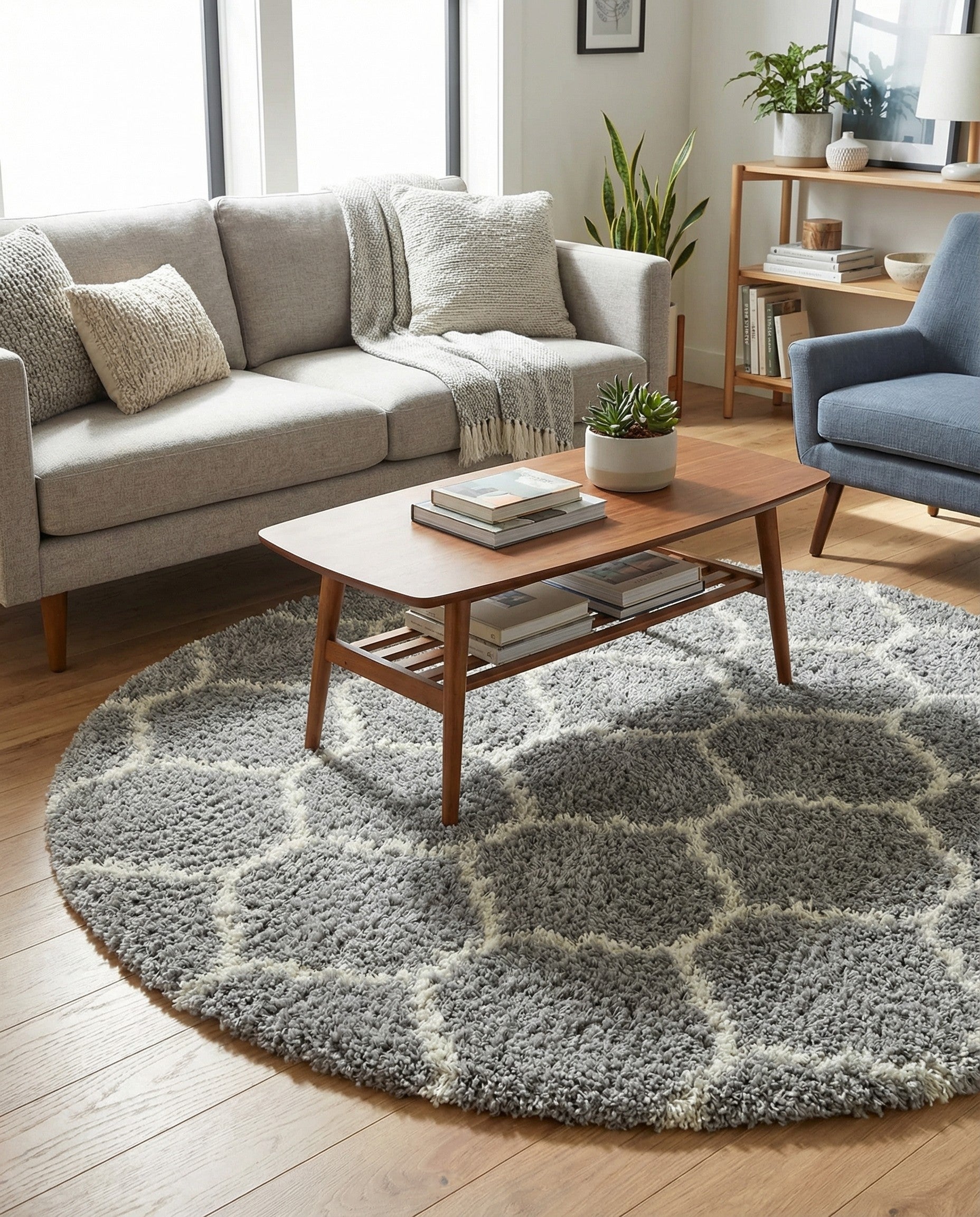 A 6' 0 x 6' 0 round gray shag rug with a white modern trellis pattern, featuring a textured high/low pile.