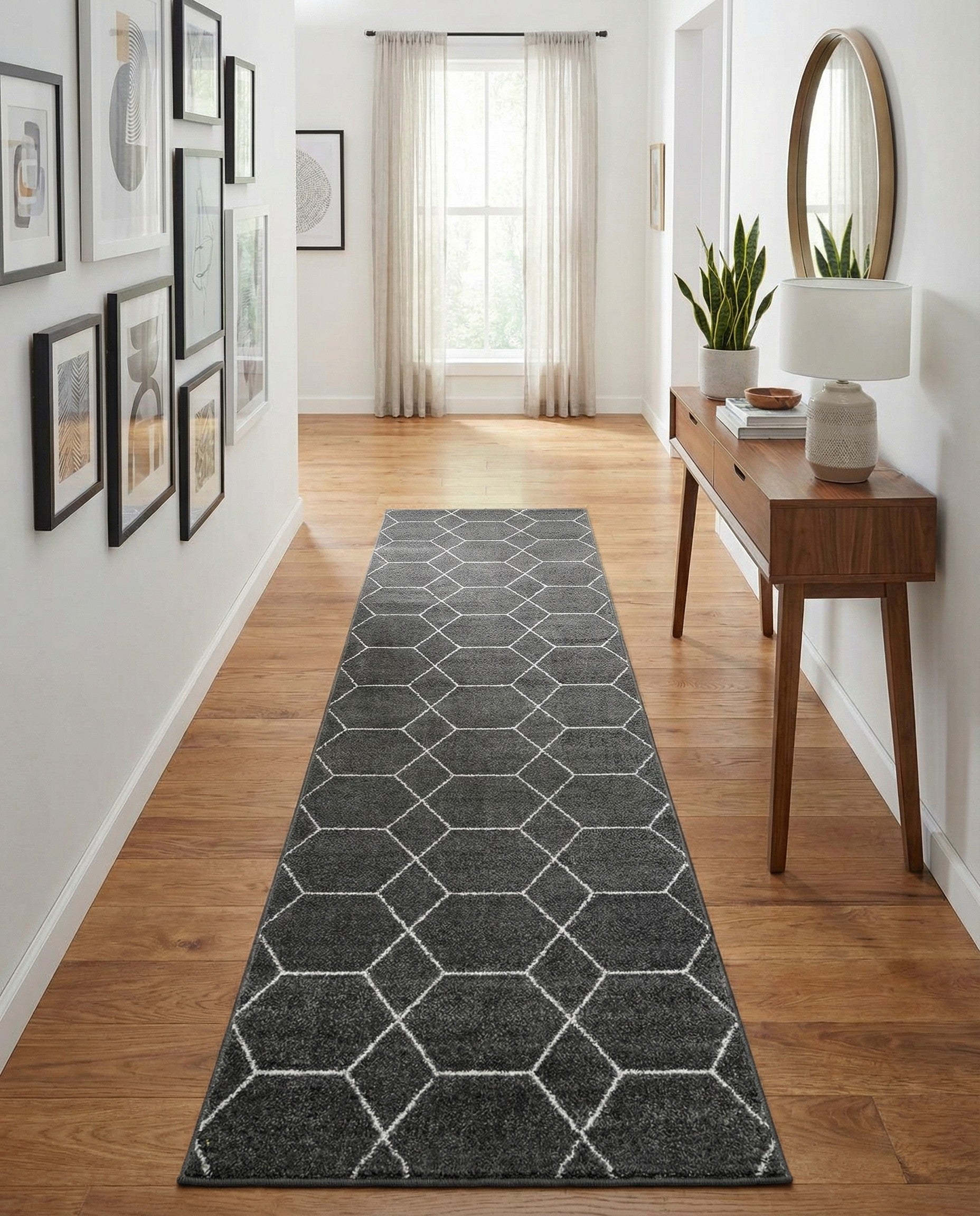 A long 20 ft runner rug in dark gray with a repeating modern white trellis pattern, suitable for a hallway.