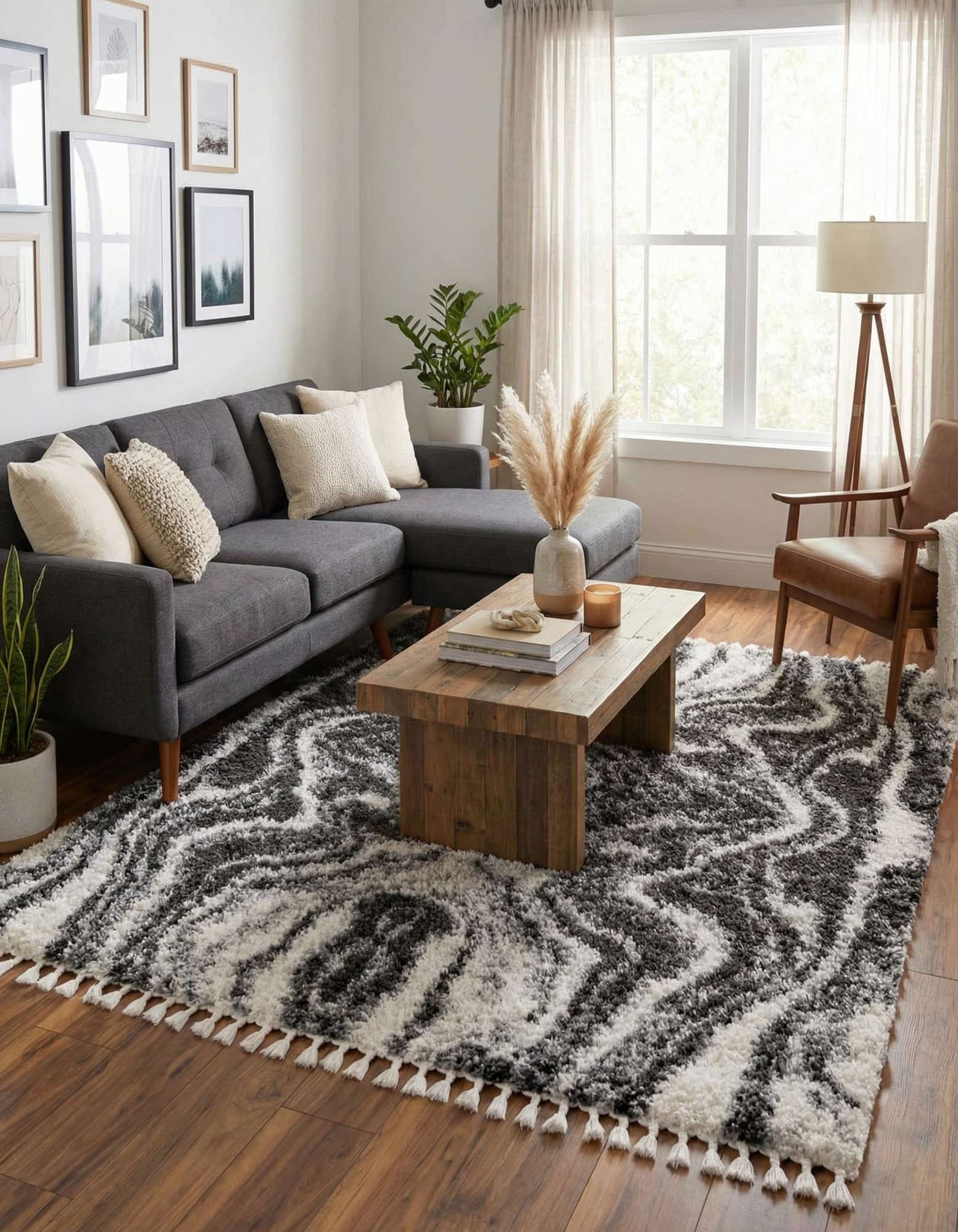 A rectangular 8x10 Athena Shag rug featuring a bold, modern black and white wavy stripe pattern with a plush pile.