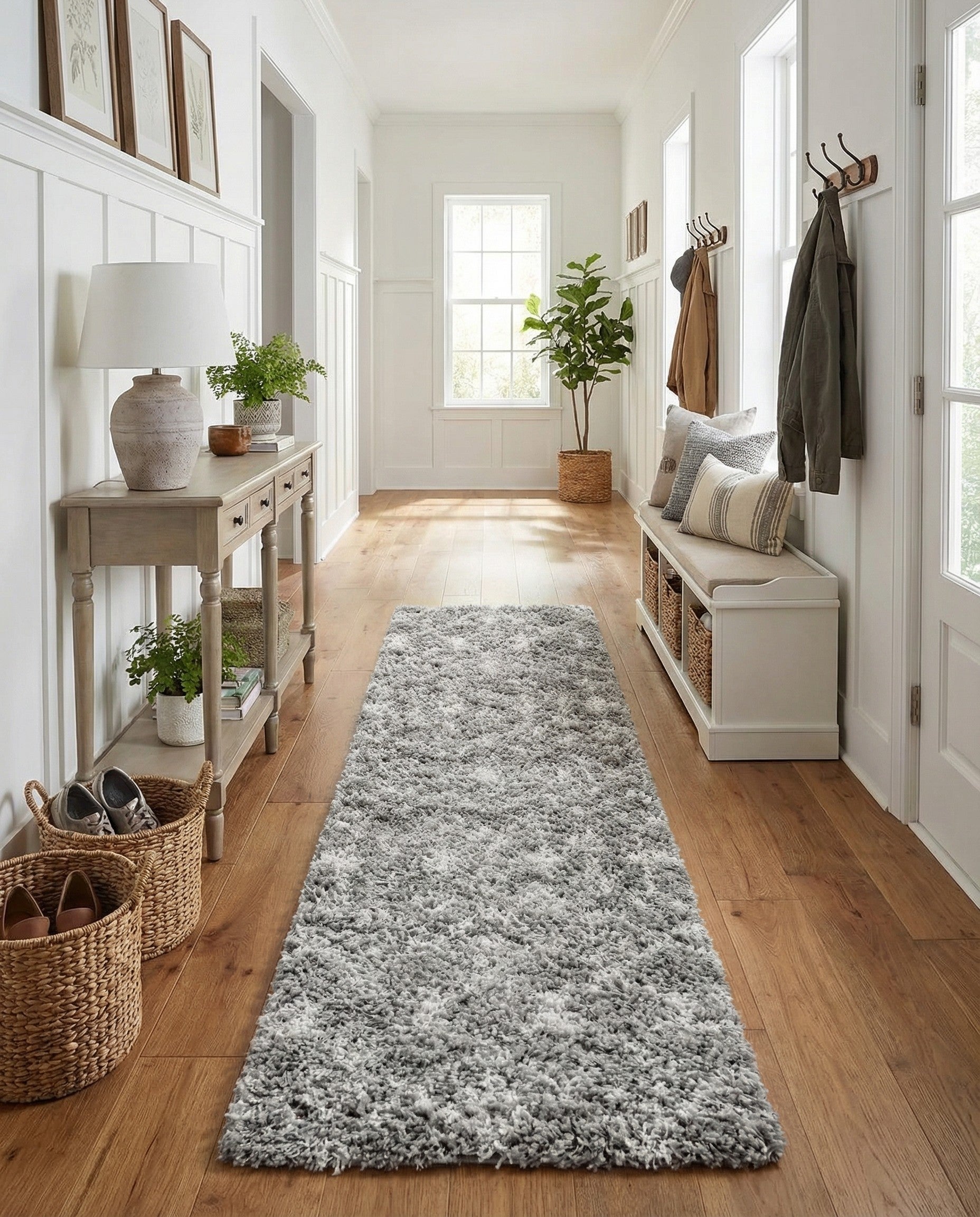 A long 16 ft runner rug with a gray and off-white tribal pattern, featuring a plush shag pile.