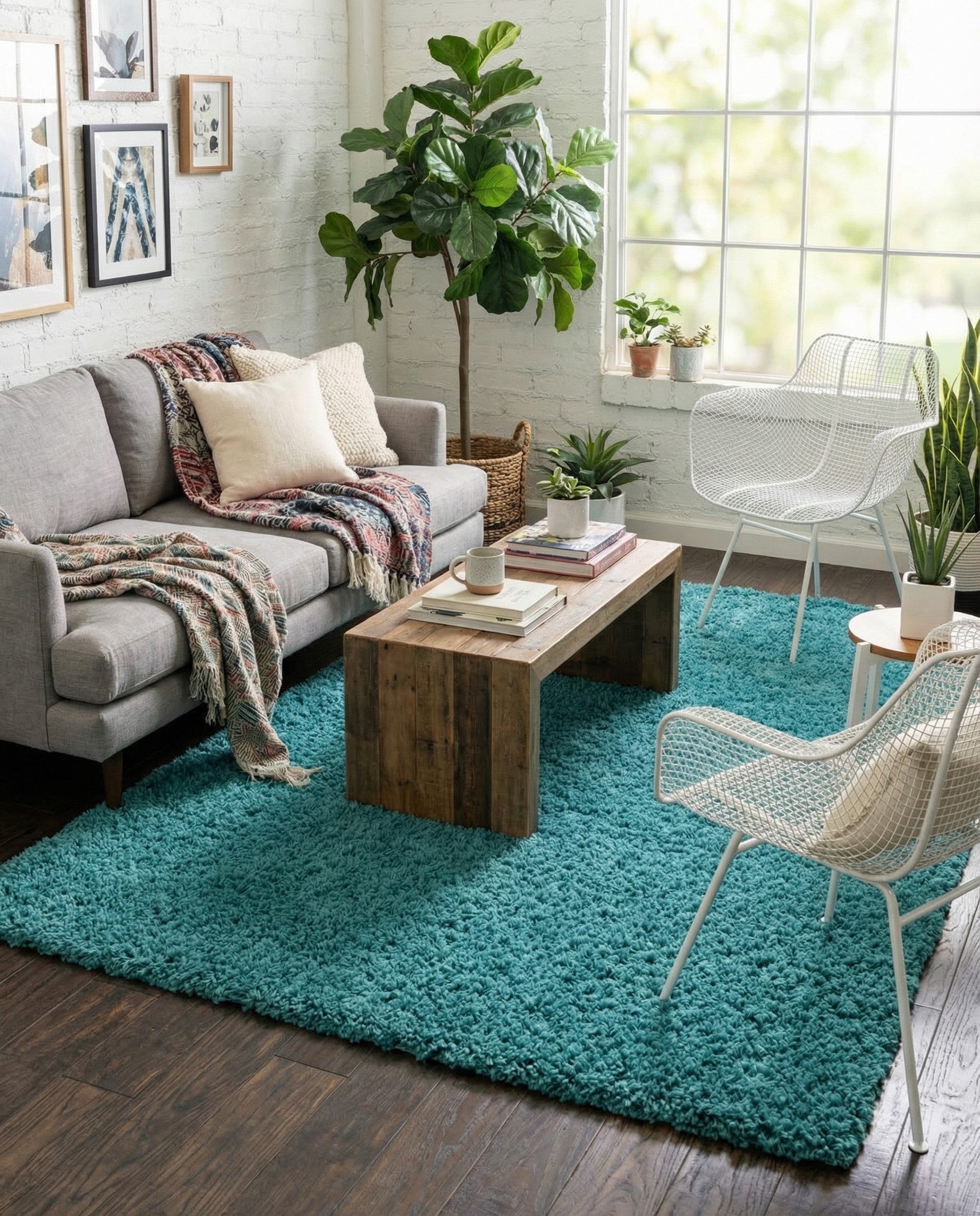 A rectangular 6x9 teal blue shag area rug with a plush, textured pile, perfect for a modern living room.