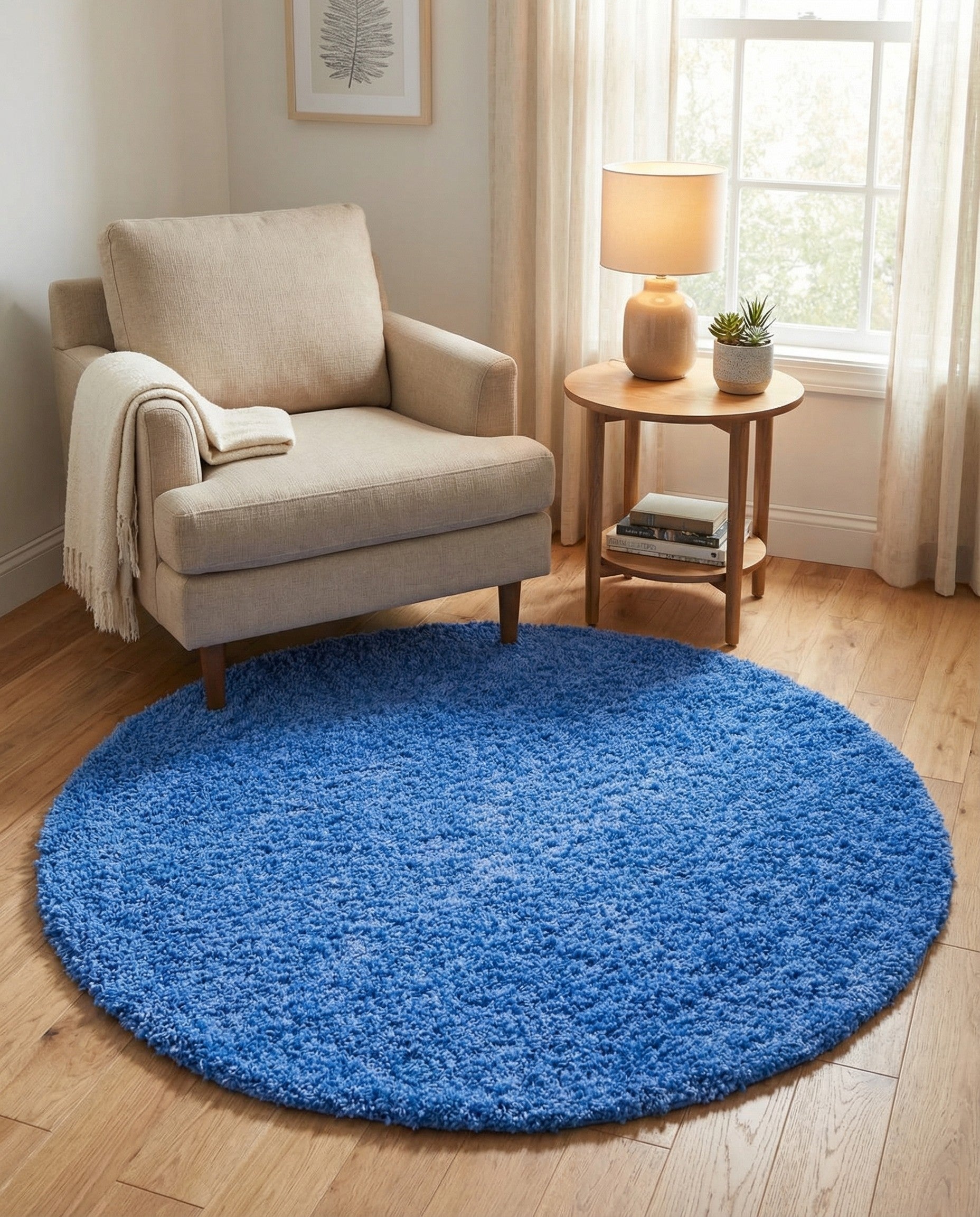 A vibrant blue 4' round shag rug with a plush, textured pile, perfect for adding a pop of color to any indoor space.