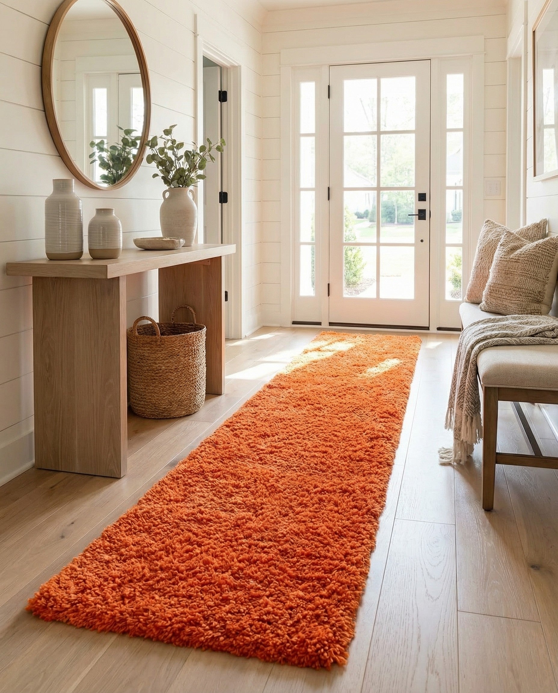 A long, plush orange shag runner rug with a textured pile, perfect for a hallway or kids' room.