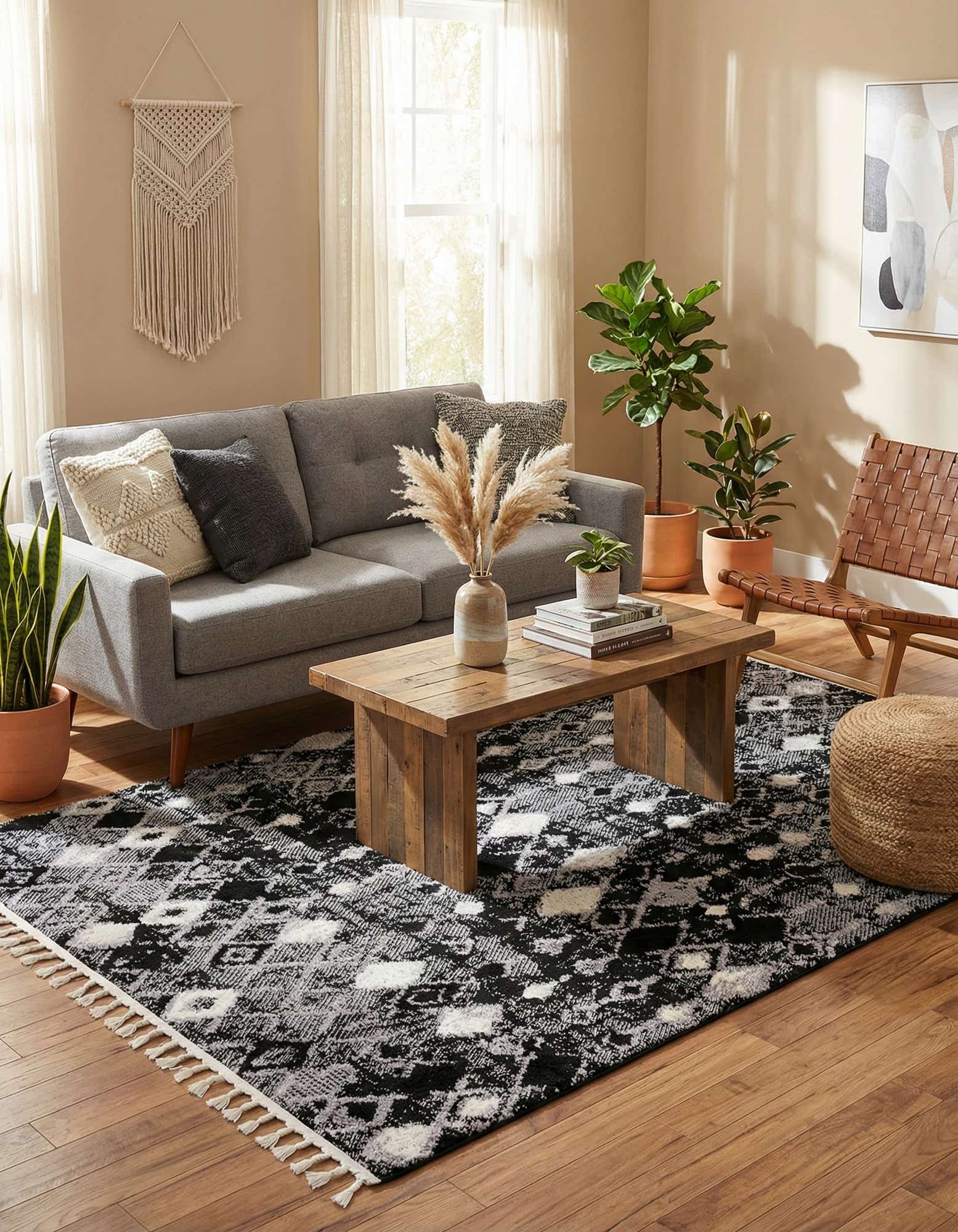 A 6x9 rectangular gray tribal rug with a modern geometric diamond pattern and textured pile, featuring black, white, and various shades of gray.