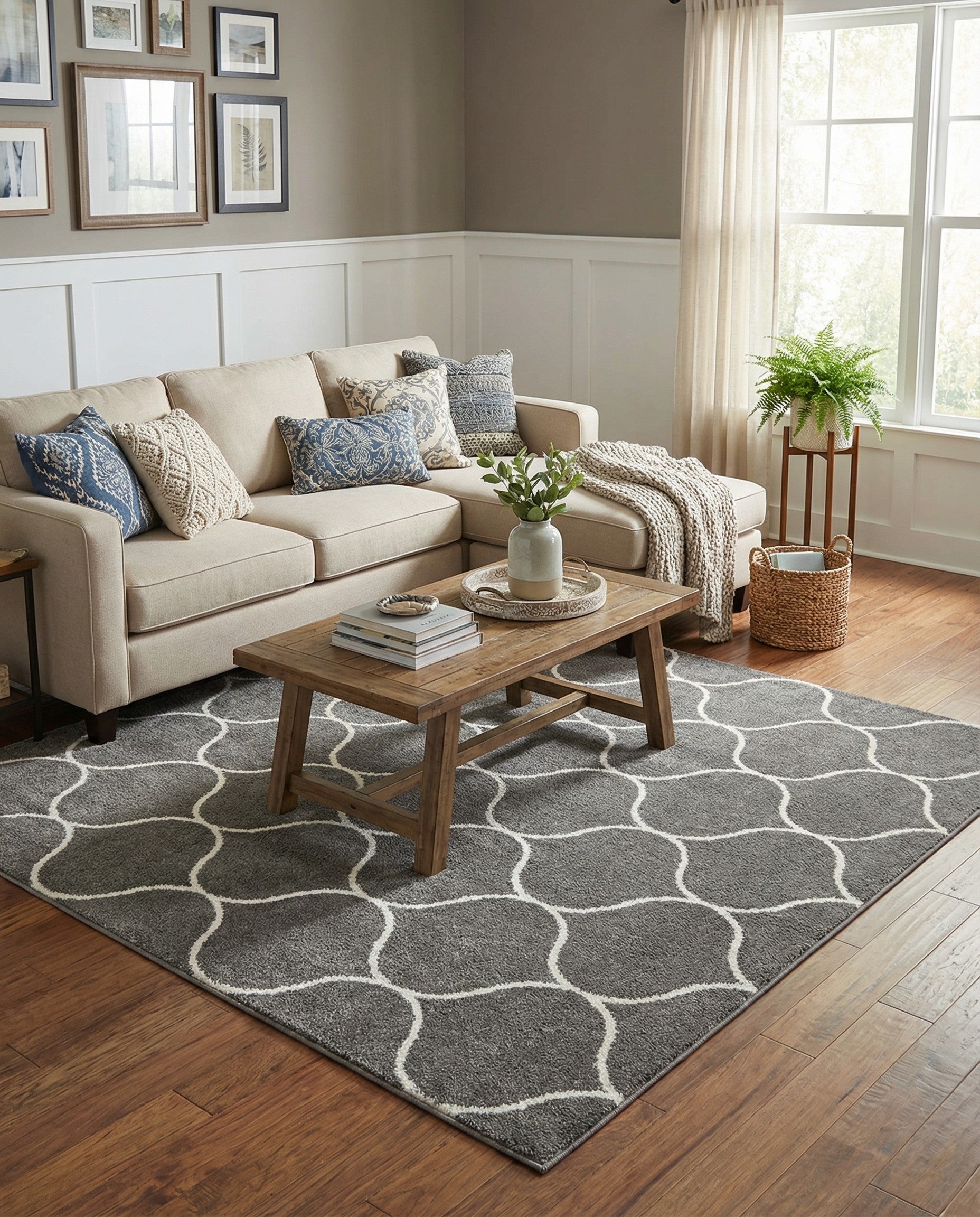 A 7' 0 x 7' 0 square gray area rug with a repeating white modern trellis pattern, suitable for indoor spaces.