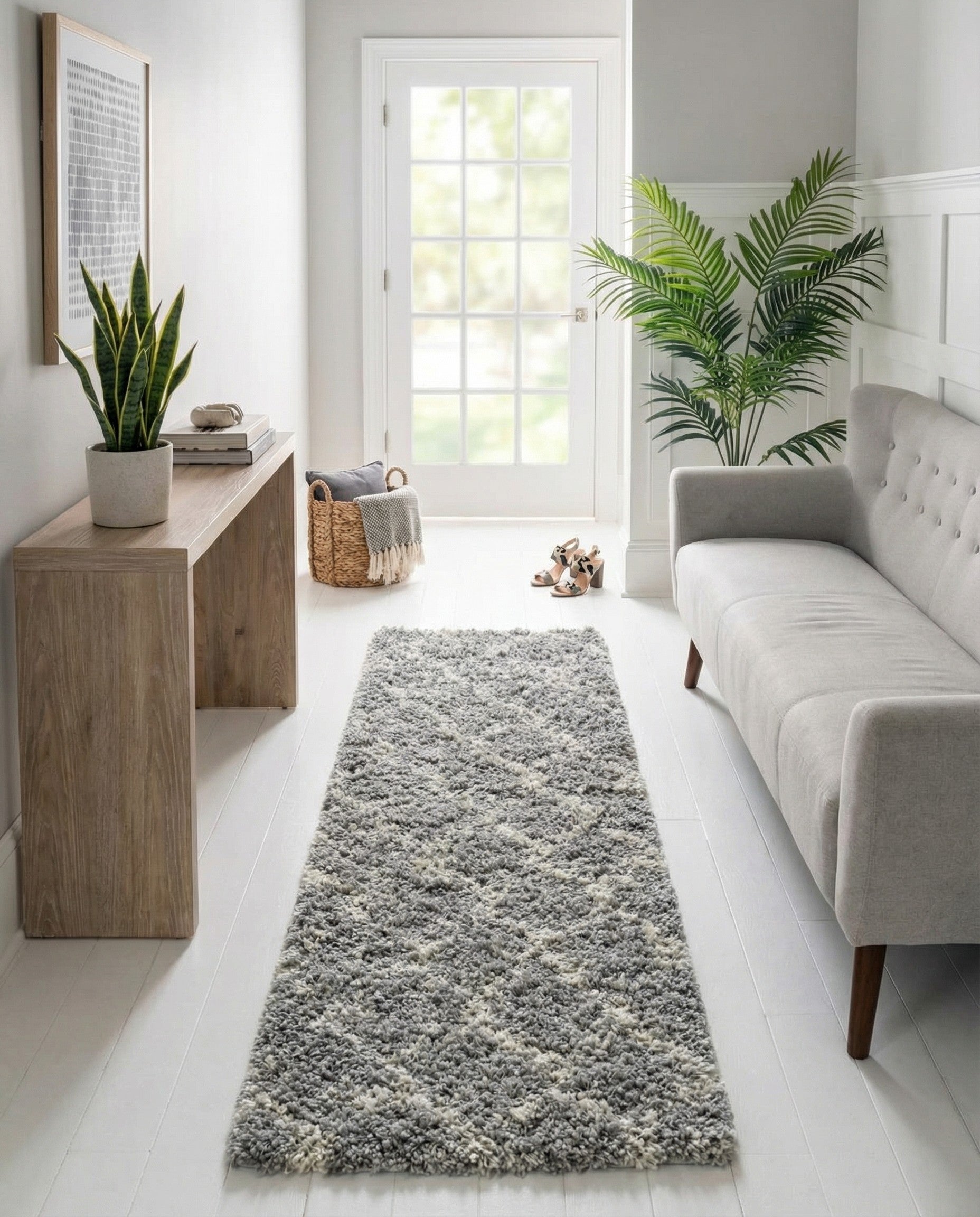 A 12 ft gray runner rug with a modern trellis pattern and textured high/low pile, ideal for hallways.