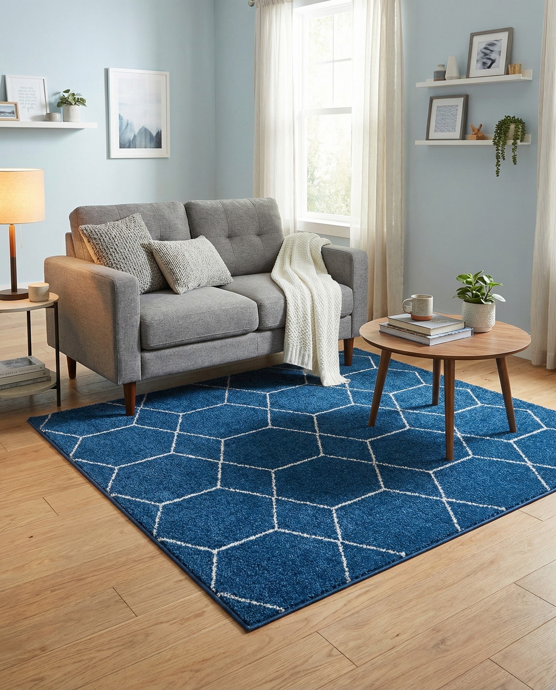 A 4'x4' square navy blue modern rug with a white geometric trellis pattern, suitable for indoor use.