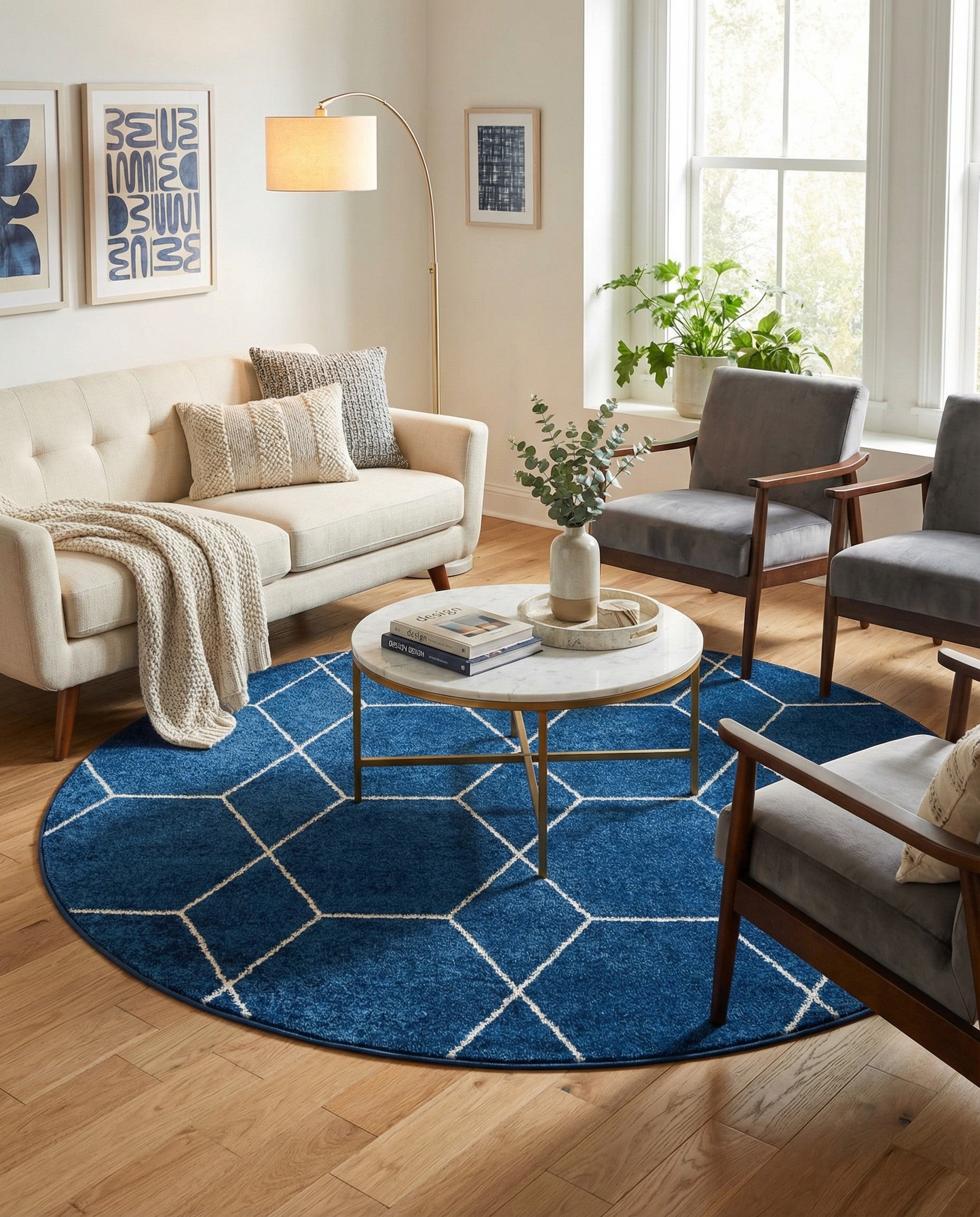 A round navy blue rug with a white geometric trellis pattern, suitable for a modern living space.