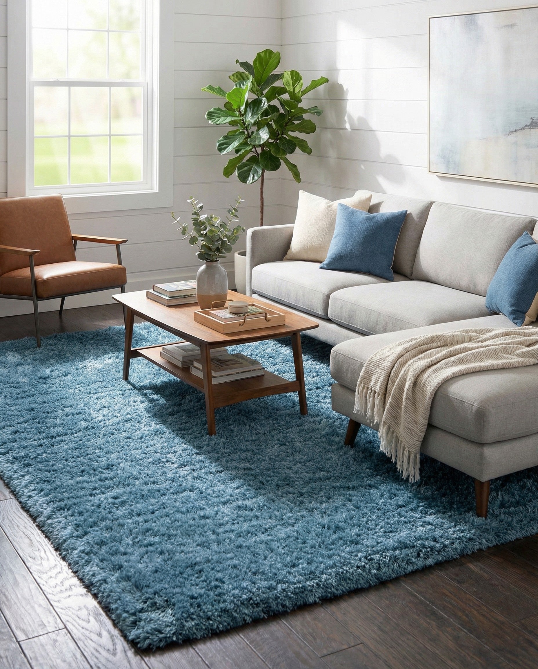 A plush 8x10 rectangular Infinity Shag rug in a deep blue color, ideal for a modern living room.
