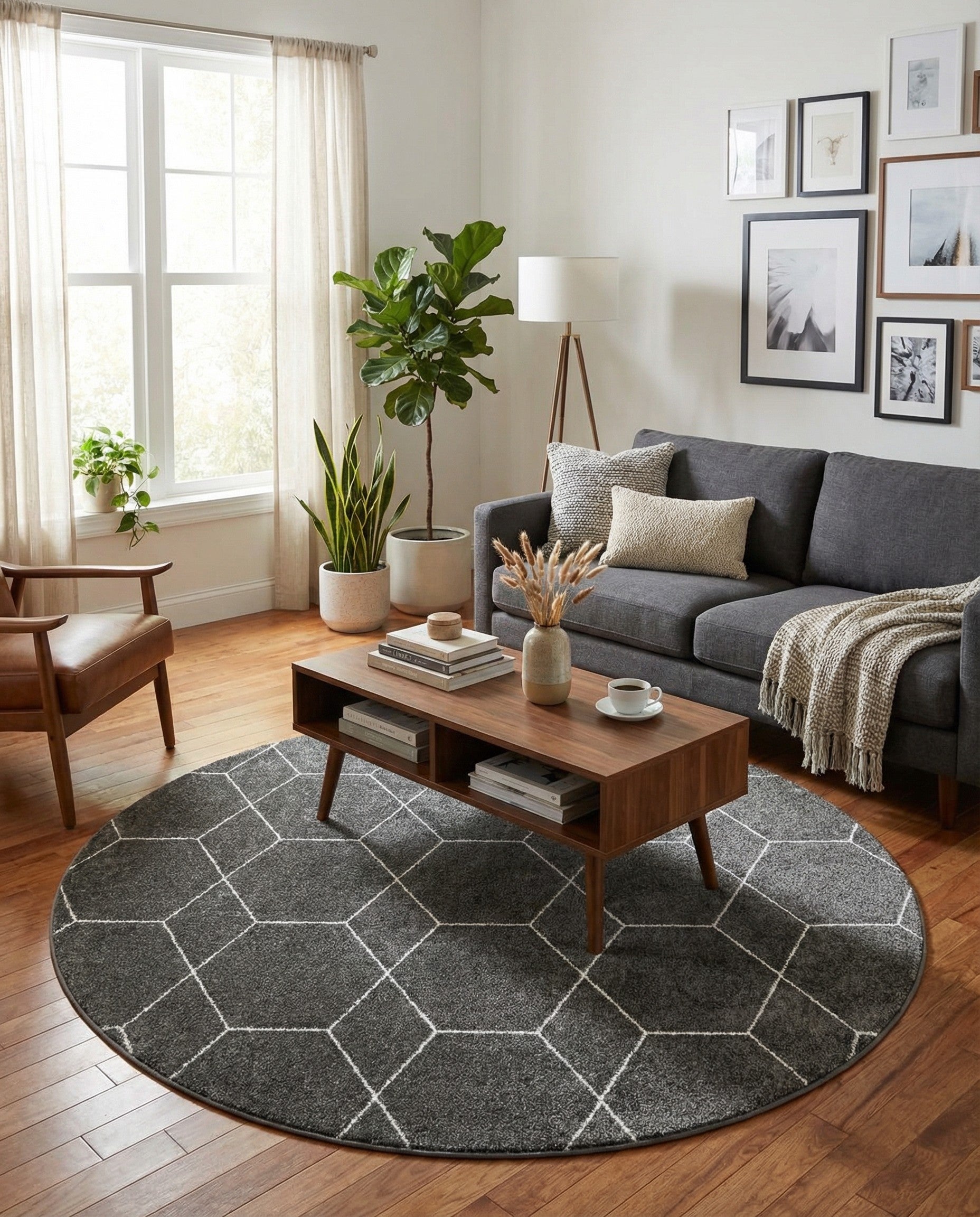 A 6' 0 x 6' 0 round gray rug with a white modern geometric trellis pattern, suitable for indoor spaces.