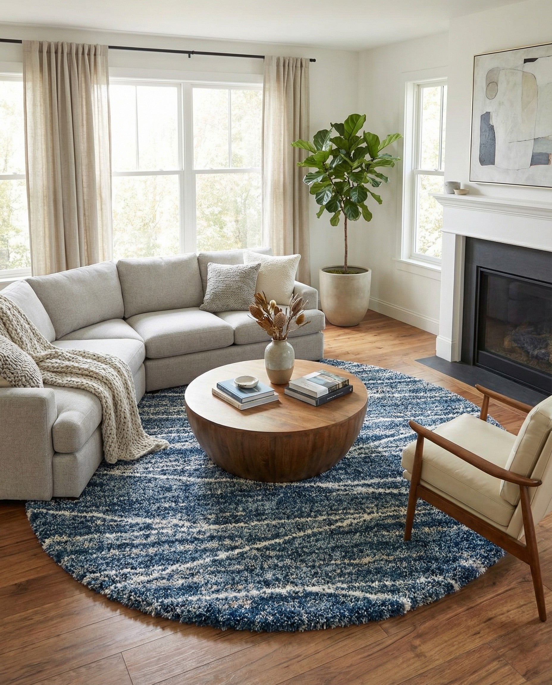 A 10-foot round blue shag rug with a modern, textured white stripe pattern, suitable for indoor spaces.