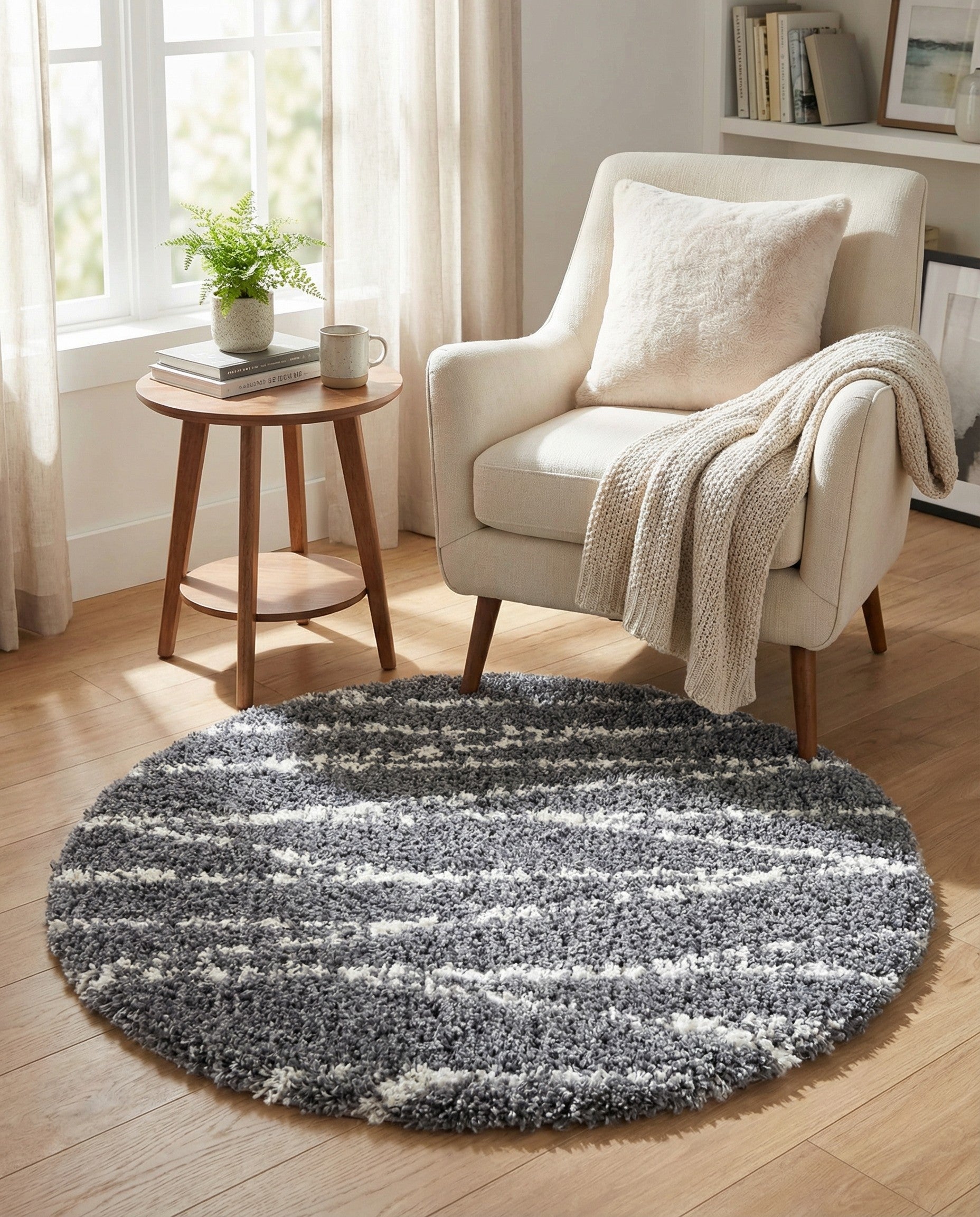 A round 3' 3 x 3' 3 gray shag rug with wavy white stripes, showcasing its plush texture.