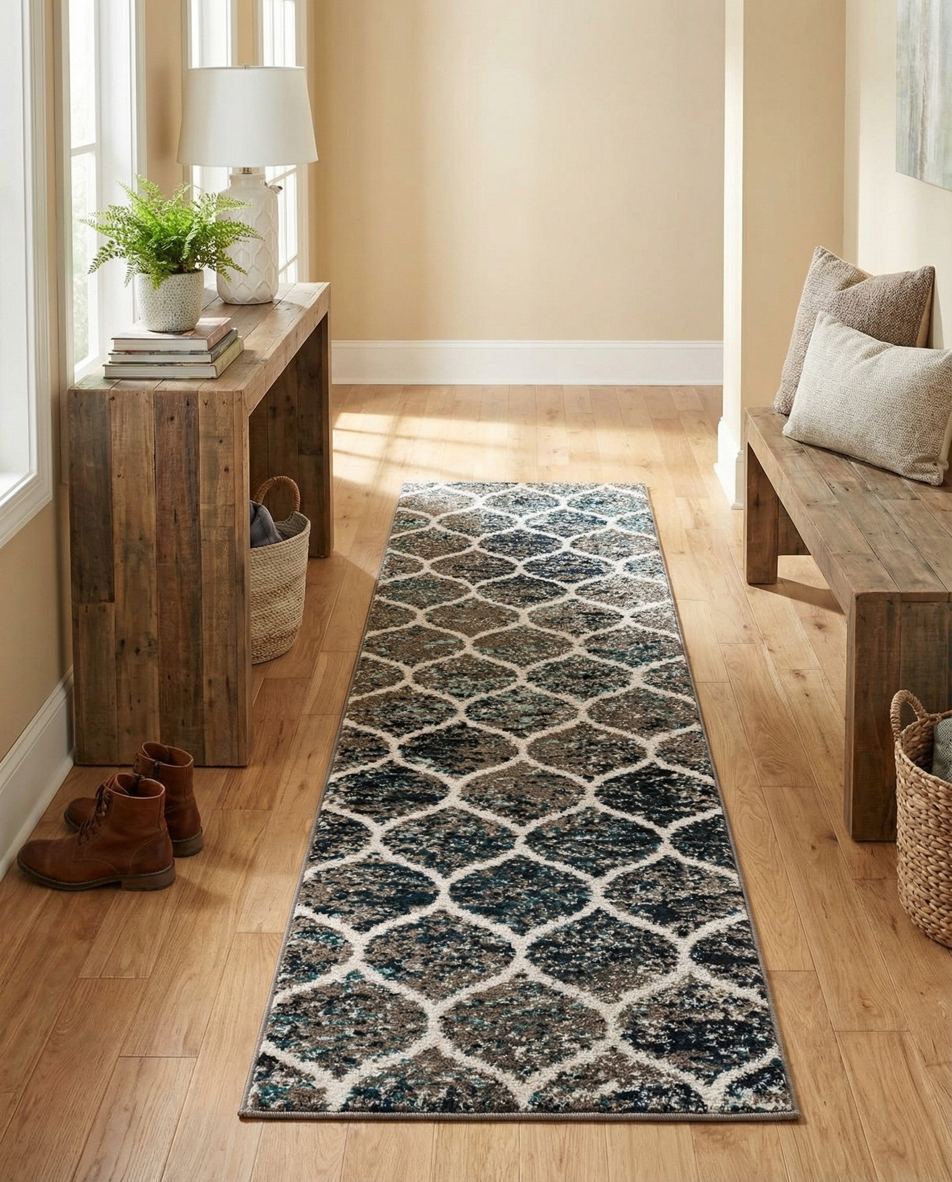 A 7 ft runner rug in a modern trellis pattern with shades of blue, brown, and cream, ideal for a hallway.