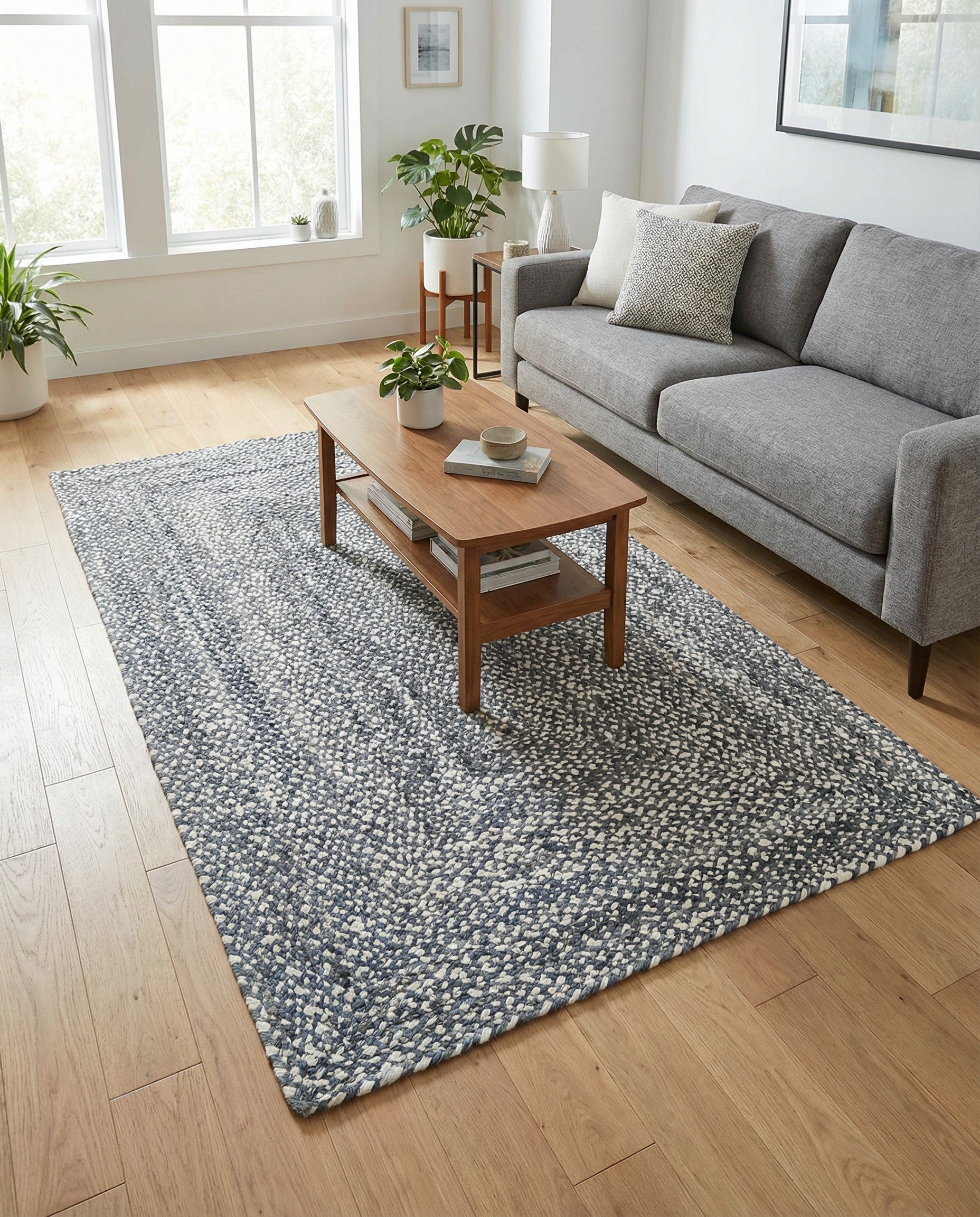 A 5x8 rectangular Braided Chindi rug in shades of gray and silver, featuring a textured, modern stripe pattern.
