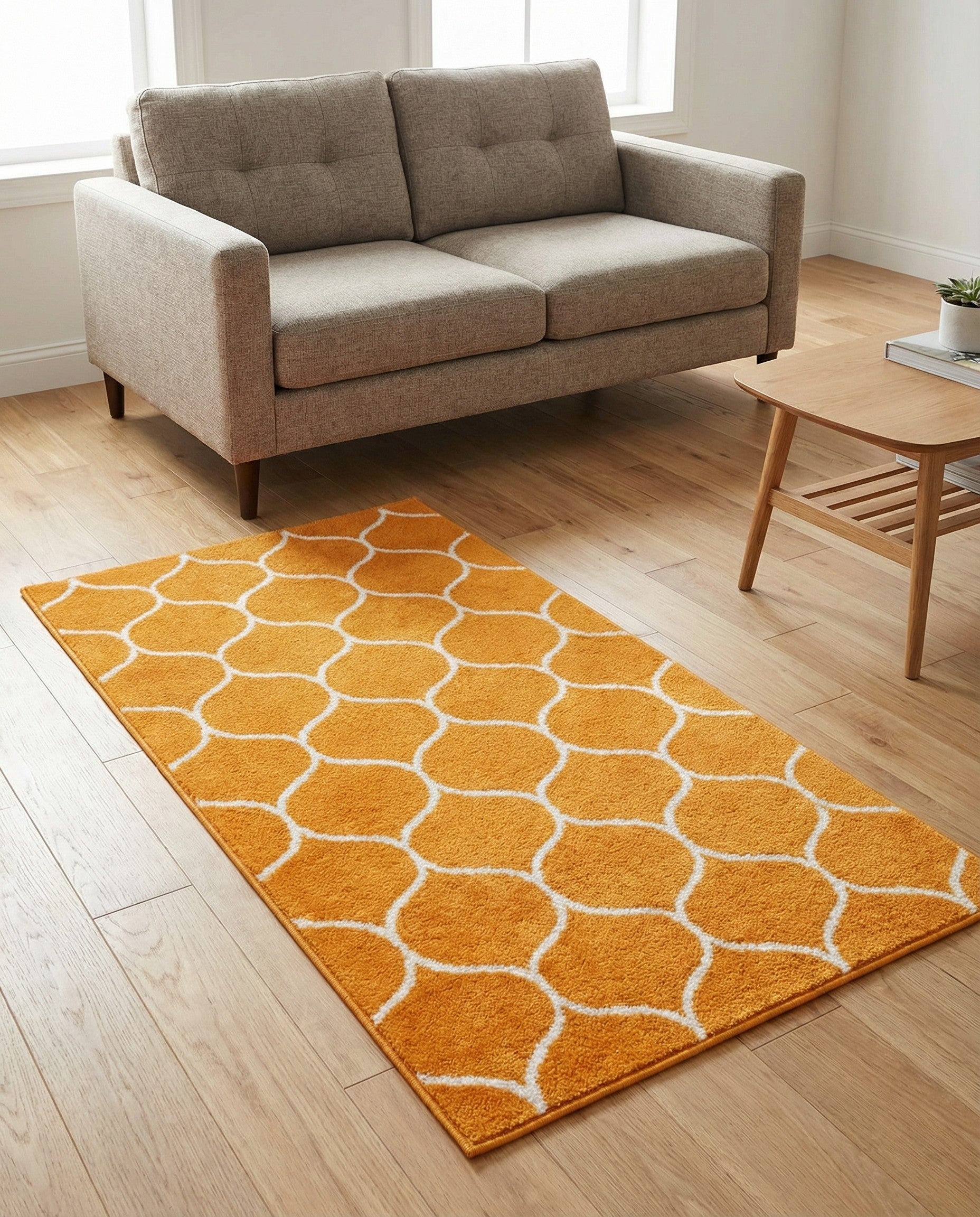 A 3x5 rectangular orange area rug with a white modern trellis pattern, suitable for a kitchen or entryway.