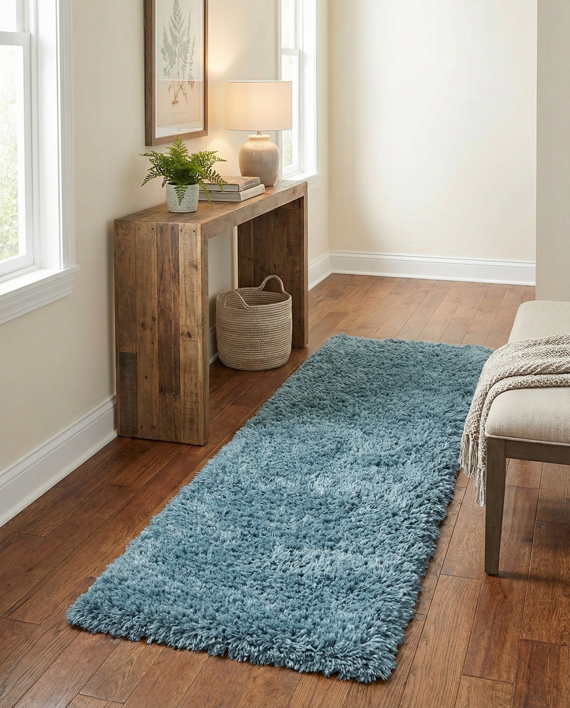 A soft, plush 7 ft blue shag runner rug with a textured pile, perfect for a hallway.