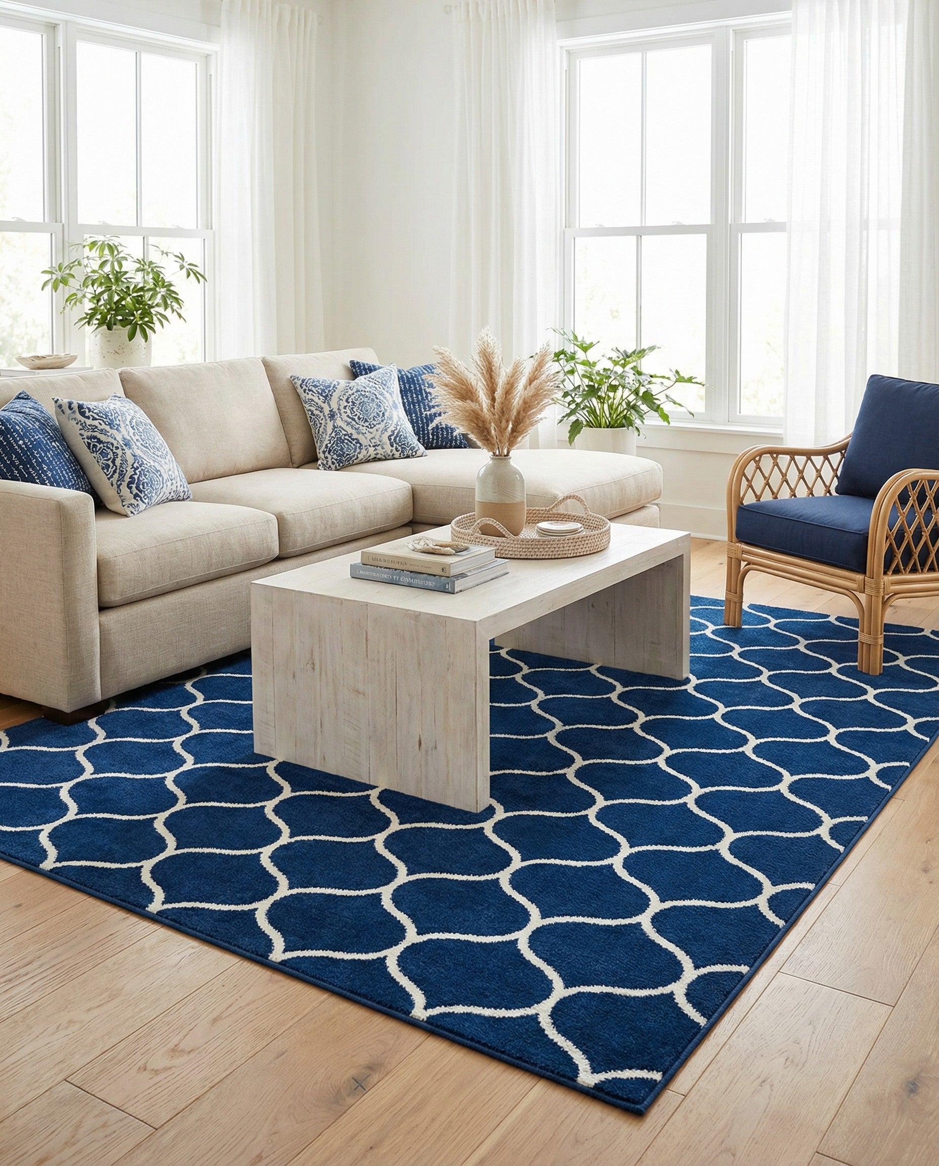 A rectangular 8x10 navy blue area rug featuring a repeating white modern trellis pattern, suitable for a living room.