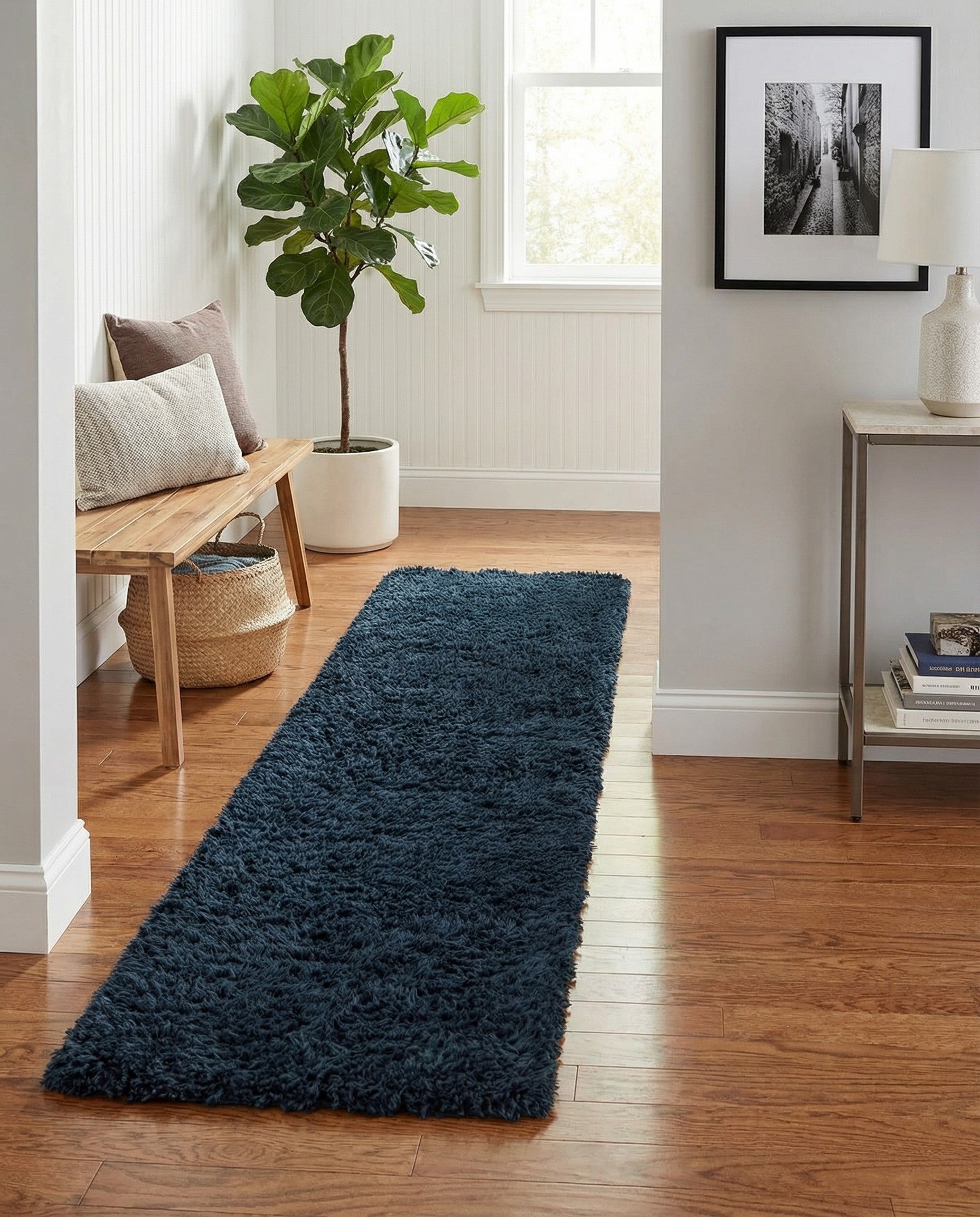 A plush, dark blue 7 ft runner rug with a shaggy texture, perfect for a hallway.