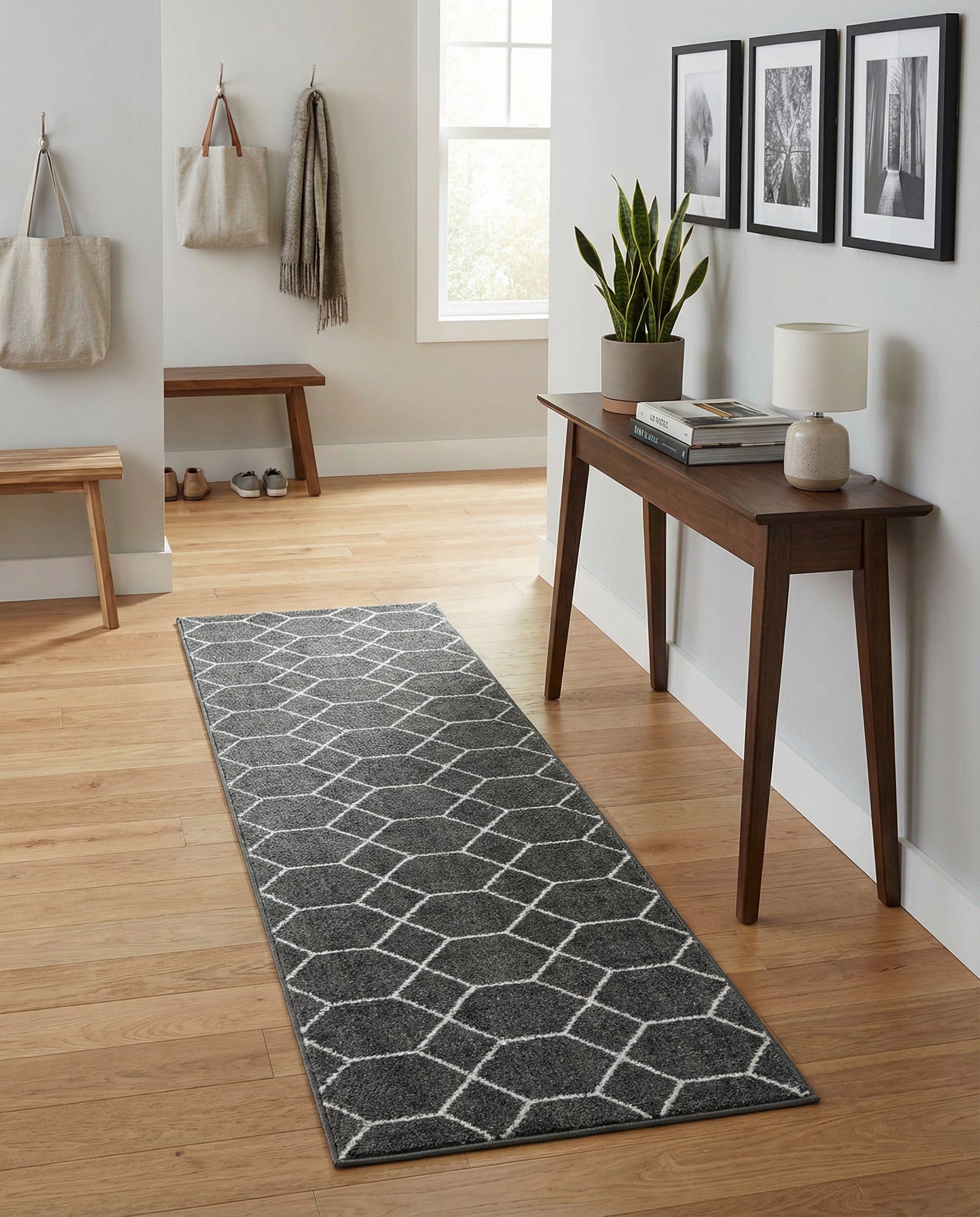 A 6 ft runner rug in dark gray with a repeating white modern trellis pattern, ideal for a hallway or kitchen.